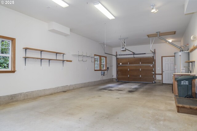 110 SW 61st St, South Beach, OR 97366 - garage featuring gas water heater and a garage door opener