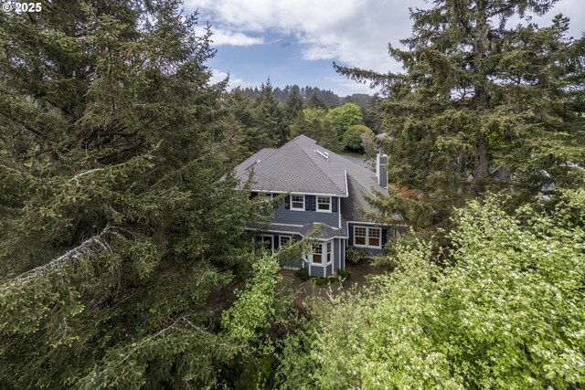 110 SW 61st St, South Beach, OR 97366 - view from above of property with a heavily wooded area