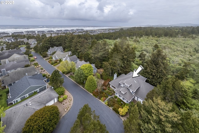 110 SW 61st St, South Beach, OR 97366 - aerial view of property's location with a nearby body of water, a heavily wooded area, and nearby suburban area