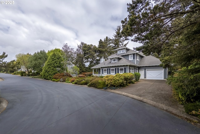 110 SW 61st St, South Beach, OR 97366 - view of front of home with concrete driveway and a garage