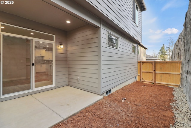 view of side of property featuring a patio area