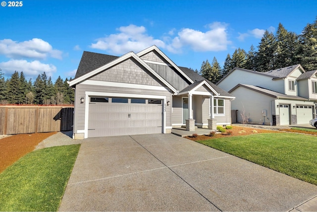 5591 N 93rd Ave Unit Lt206, Camas, WA 98607 - craftsman house featuring roof with shingles, a front yard, fence, a garage, and driveway