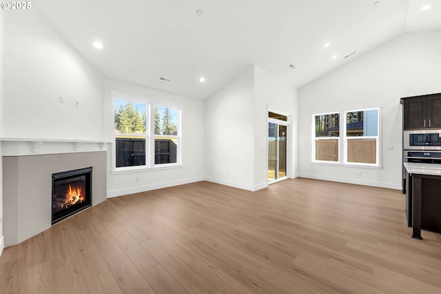 5591 N 93rd Ave Unit Lt206, Camas, WA 98607 - unfurnished living room featuring recessed lighting, a fireplace, visible vents, and lofted ceiling