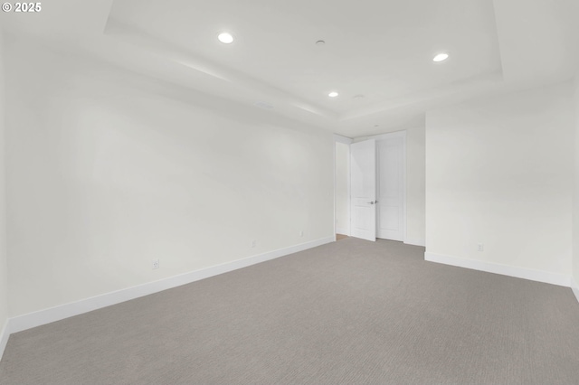 5591 N 93rd Ave Unit Lt206, Camas, WA 98607 - carpeted empty room featuring a raised ceiling, baseboards, and recessed lighting