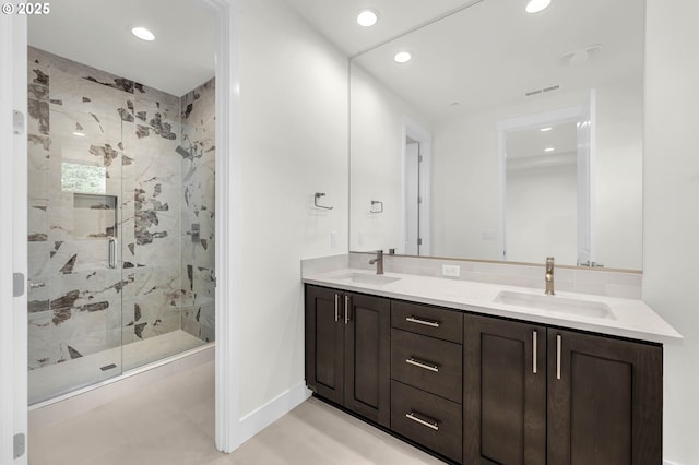 5591 N 93rd Ave Unit Lt206, Camas, WA 98607 - bathroom featuring a marble finish shower, a sink, and recessed lighting