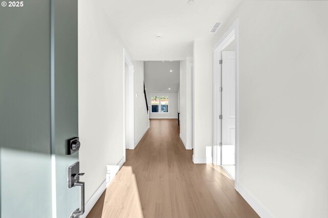 5591 N 93rd Ave Unit Lt206, Camas, WA 98607 - hallway featuring wood finished floors, baseboards, and visible vents