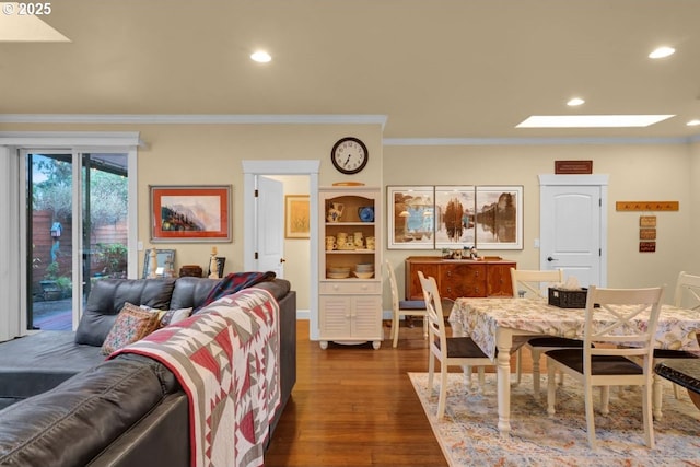 interior space featuring recessed lighting, dark wood finished floors, a skylight, and crown molding