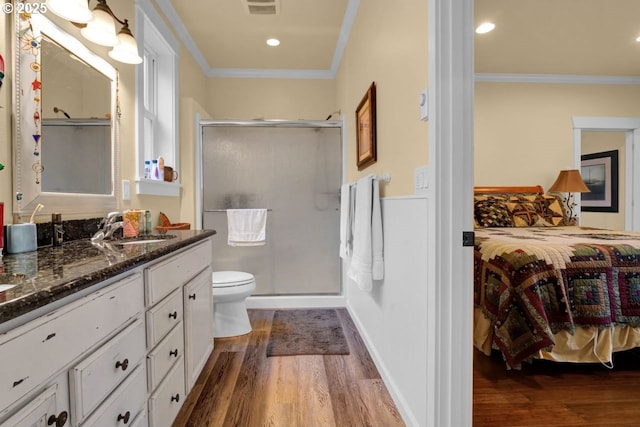 full bathroom featuring crown molding, wood finished floors, a stall shower, and ensuite bathroom