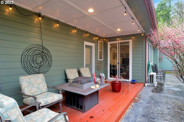 deck featuring an outdoor fire pit