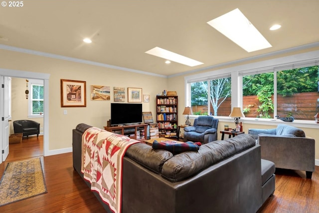 living room with dark wood-style floors, a healthy amount of sunlight, and a skylight