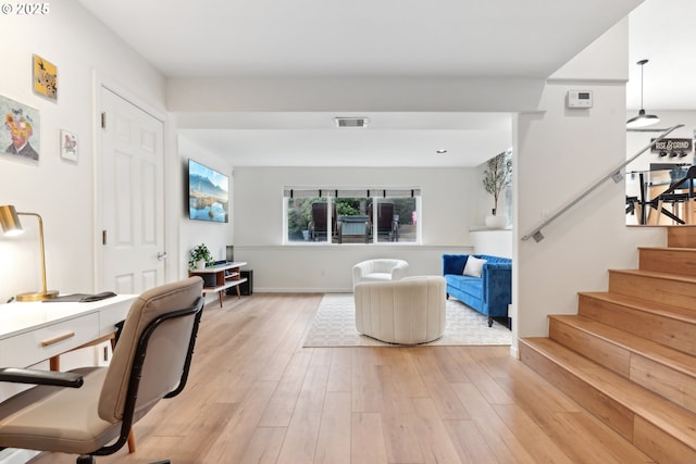 living room with light hardwood / wood-style floors