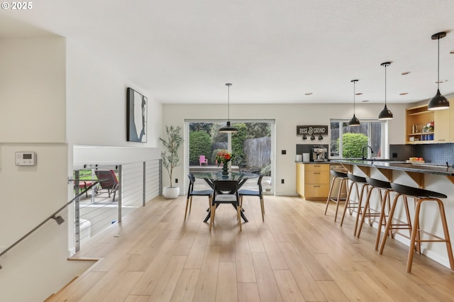 dining area featuring light wood-type flooring
