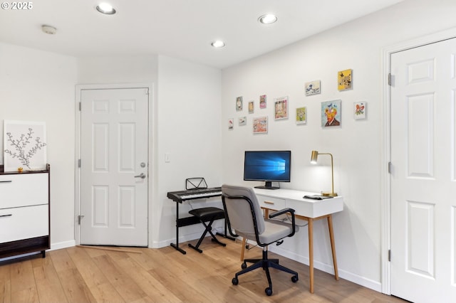 office featuring recessed lighting, light wood-style floors, and baseboards