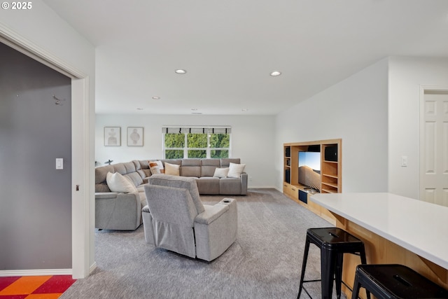 living room with recessed lighting, carpet flooring, and baseboards