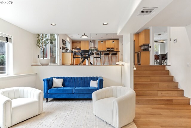 living room with light hardwood / wood-style floors