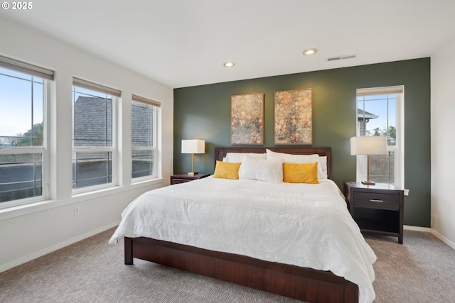bedroom with recessed lighting, baseboards, visible vents, and carpet floors