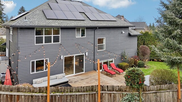 wooden deck featuring a hot tub and an outdoor hangout area