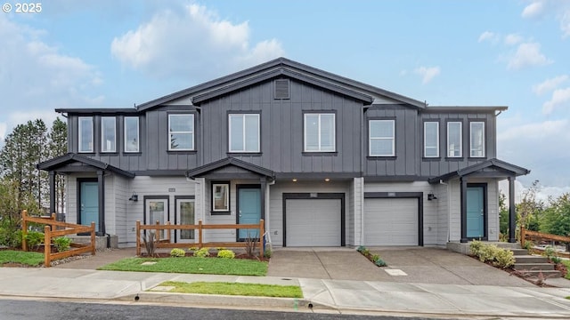 view of front of property featuring a garage, board and batten siding, and concrete driveway