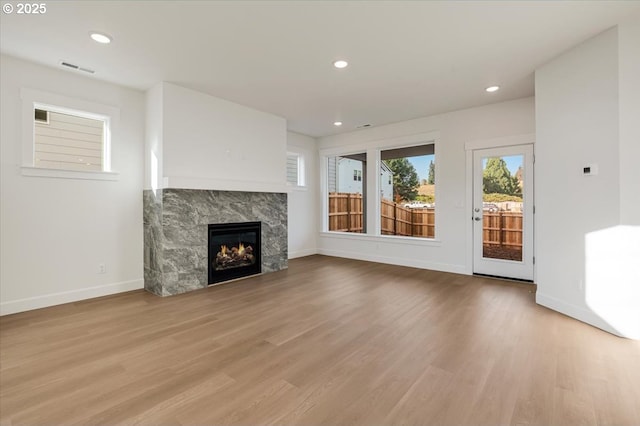 unfurnished living room featuring light hardwood / wood-style floors