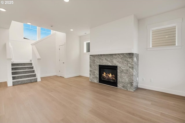 unfurnished living room featuring light hardwood / wood-style floors