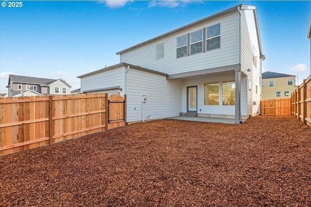 back of property with a patio area