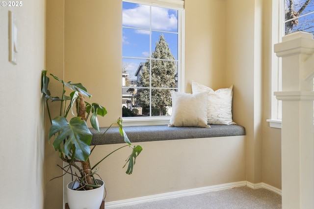 sitting room with carpet flooring and baseboards