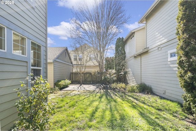 view of yard featuring a patio area and fence