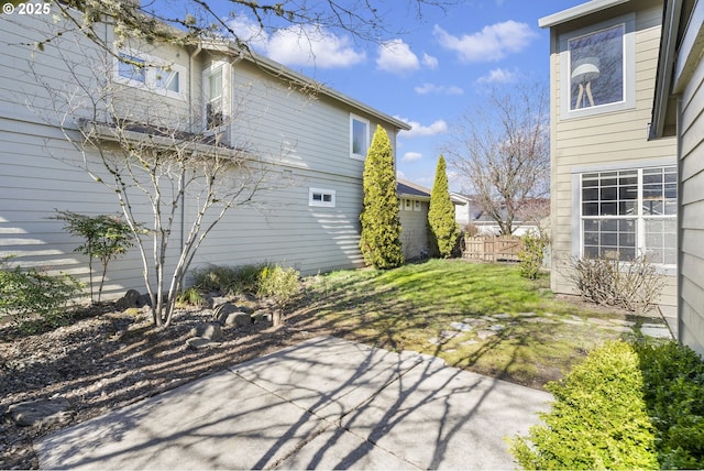 exterior space featuring a patio area and fence