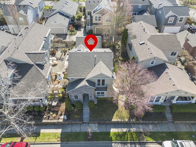 birds eye view of property with a residential view