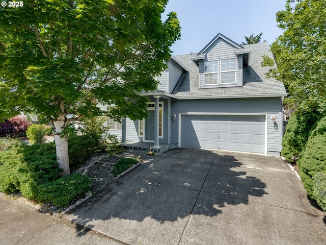 1610 SE 186th Pl, Vancouver, WA 98683 - view of front of house with roof with shingles and concrete driveway