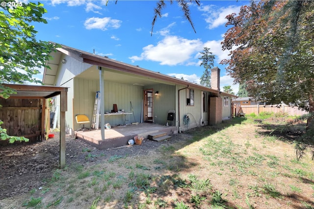 5430 E St, Springfield, OR 97478 - rear view of property with a chimney