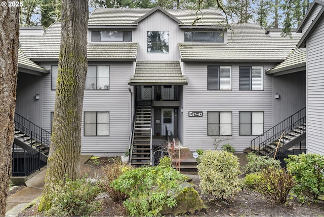 view of front of home featuring stairs