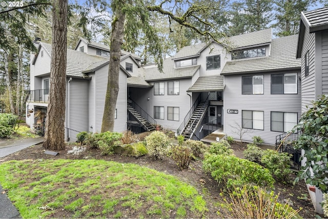 view of front of property featuring stairs