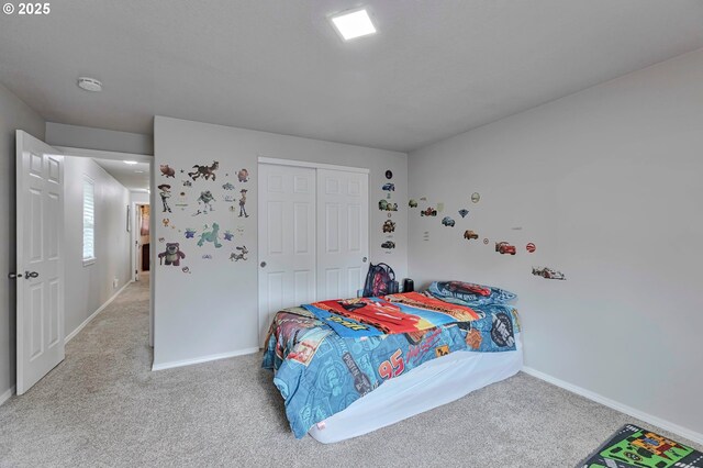 3963 NW 148th Pl, Portland, OR 97229 - bedroom featuring light colored carpet, baseboards, and a closet