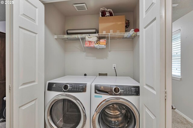3963 NW 148th Pl, Portland, OR 97229 - laundry area featuring washer and dryer, carpet flooring, and baseboards