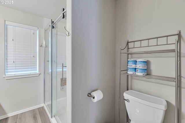 3963 NW 148th Pl, Portland, OR 97229 - bathroom featuring toilet, a stall shower, and wood finished floors