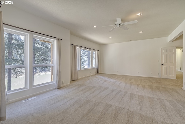 unfurnished room with light carpet, baseboards, visible vents, and recessed lighting