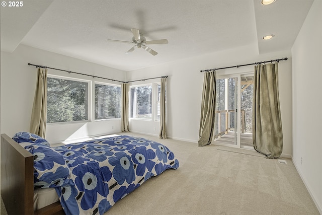 carpeted bedroom with baseboards, ceiling fan, a textured ceiling, and access to exterior