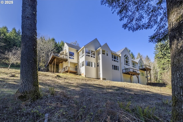 view of side of property featuring a deck