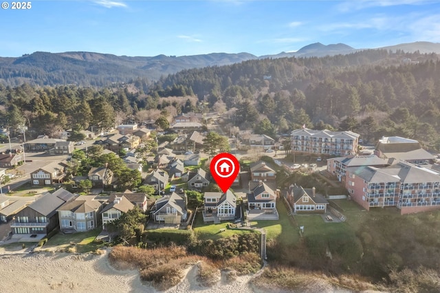 drone / aerial view featuring a mountain view