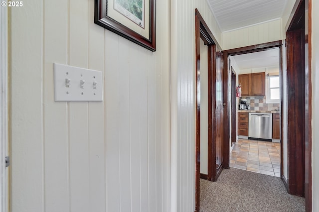 hallway with carpet floors