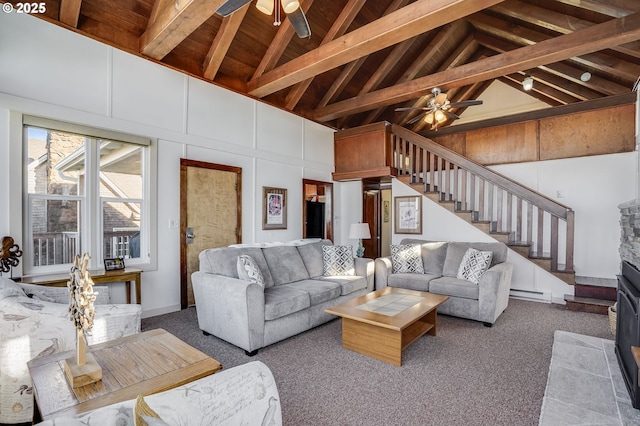 living room with high vaulted ceiling, baseboard heating, ceiling fan, beam ceiling, and carpet