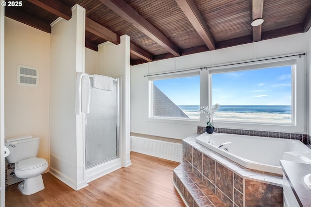 bathroom with hardwood / wood-style flooring, a water view, plenty of natural light, and toilet