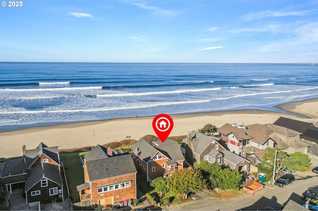 drone / aerial view with a view of the beach and a water view