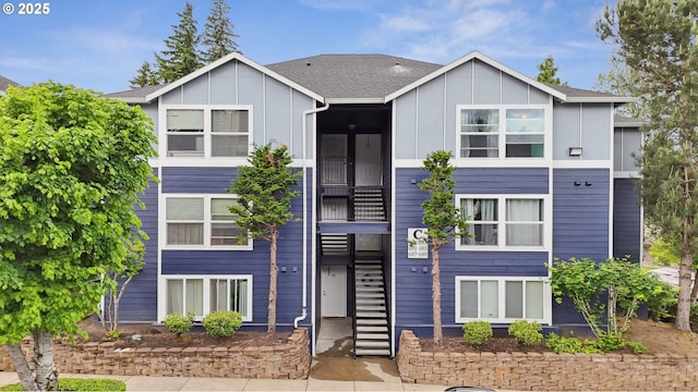 697 NE 162nd Ave Unit 308, Portland, OR 97230 - view of front of property featuring board and batten siding and stairs