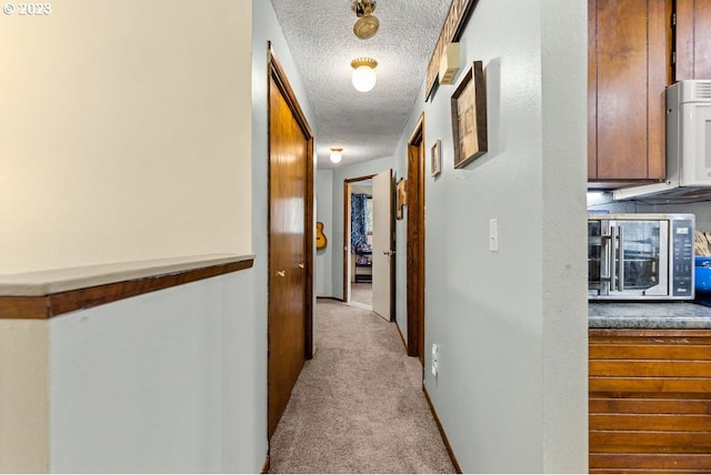 835 E 4th St, La Center, WA 98629 - hall with carpet and a textured ceiling