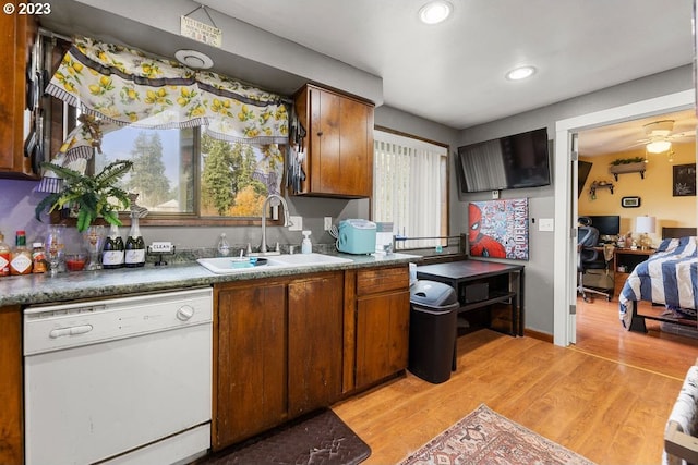 835 E 4th St, La Center, WA 98629 - kitchen with white dishwasher, light wood finished floors, brown cabinets, a ceiling fan, and recessed lighting