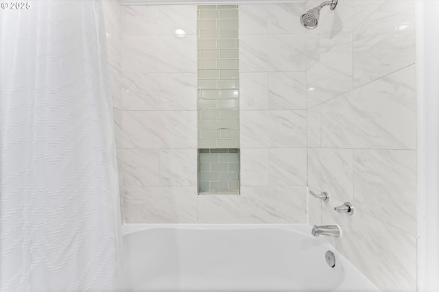 bathroom with shower / bath combination with curtain