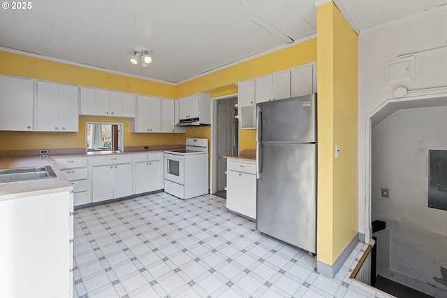 kitchen featuring electric range, freestanding refrigerator, light countertops, under cabinet range hood, and white cabinetry