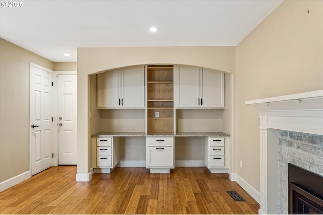 1722 Sequoia Ct, Forest Grove, OR 97116 - unfurnished office featuring a fireplace, light wood-style flooring, built in study area, and recessed lighting